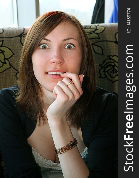 Surprised young girl portrait indoor