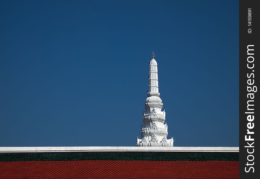 Castle cut white top with sky blue, green and red tile roof. Castle cut white top with sky blue, green and red tile roof.