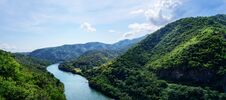 Beautiful Panorama: Top View Blue River In Green Mountains Valley. Travel, Tourism, Wanderlust Concept. Text Royalty Free Stock Photos Beautiful Panorama: Top View Blue River In Green Mountains Valley. Travel, Tourism, Wanderlust Concept. Text Royalty Free Stock Photos