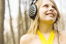 Blond Woman Smiling Listening Music In Headphones Royalty Free Stock Photos Blond Woman Smiling Listening Music In Headphones Royalty Free Stock Photos