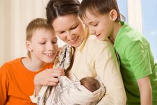 Mother With Her Three Children Stock Images