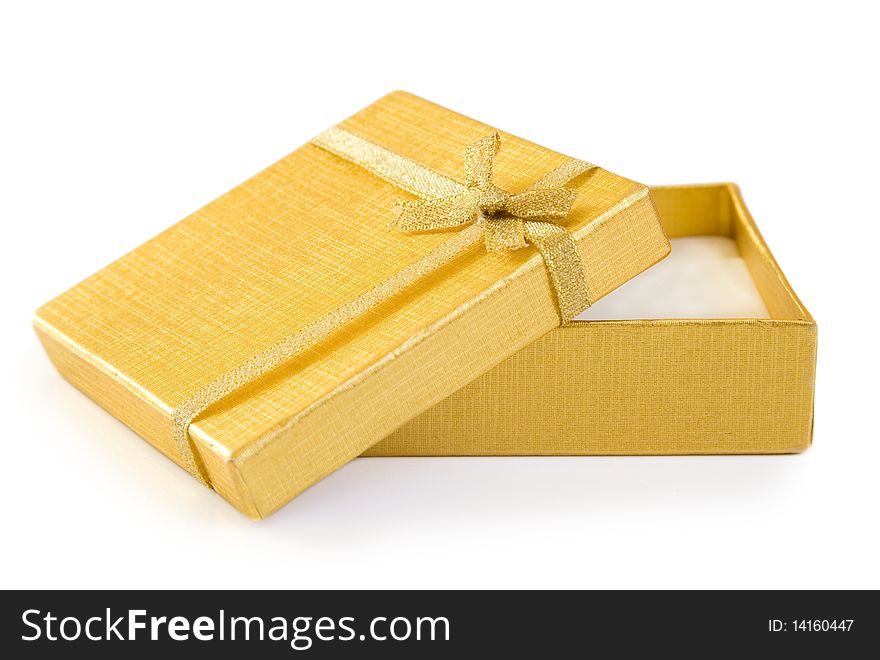 Gold gift box with a ribbon. Gold gift box with a ribbon