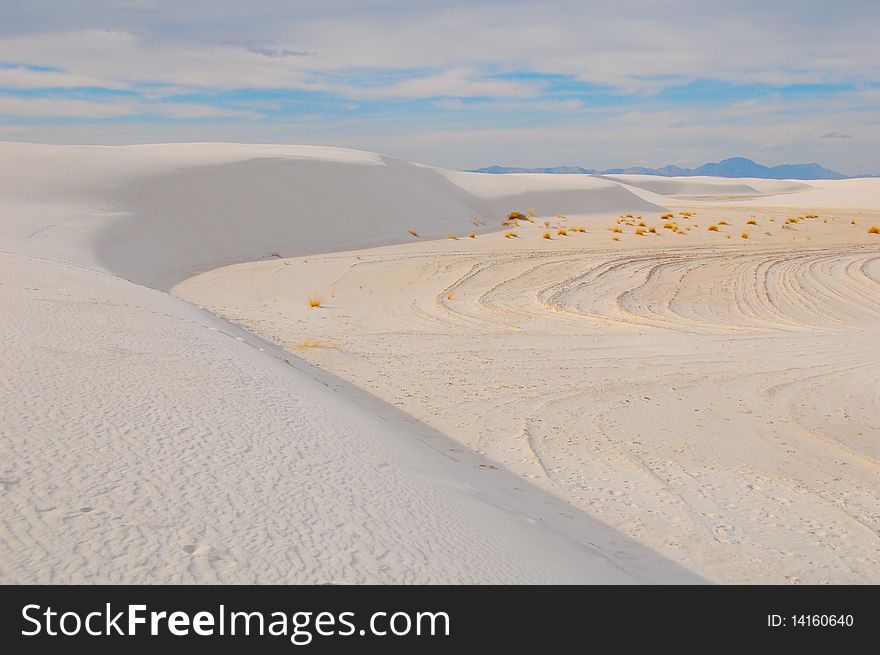 Dunes at white sands national park in new mexico with blue sky and wind patterns. Dunes at white sands national park in new mexico with blue sky and wind patterns