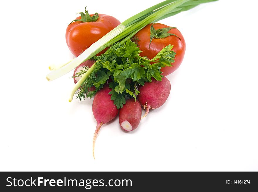 Green onions, tomatoes, radishes and green isolated on white background. Green onions, tomatoes, radishes and green isolated on white background