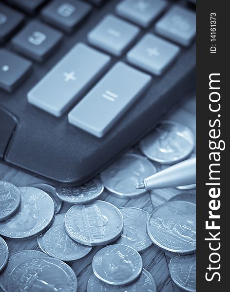 Financial Concept with coins and calculator in abstract sellenium tone. Financial Concept with coins and calculator in abstract sellenium tone