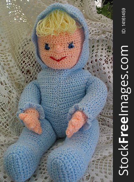 Crocheted Doll Wearing Blue