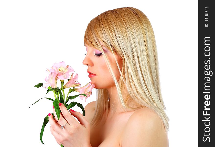 Portrait of a woman holding pink flowers over white background