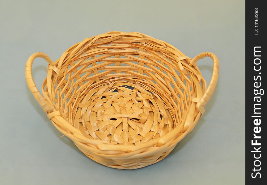 Wicker basket, isolated on grey