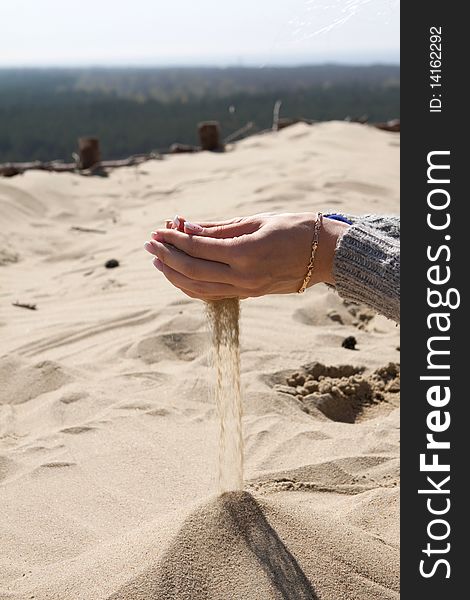 Hands Playing With Sand