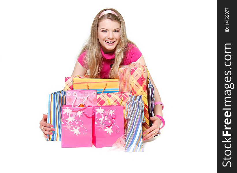 Young happy girl with shopping bags over white