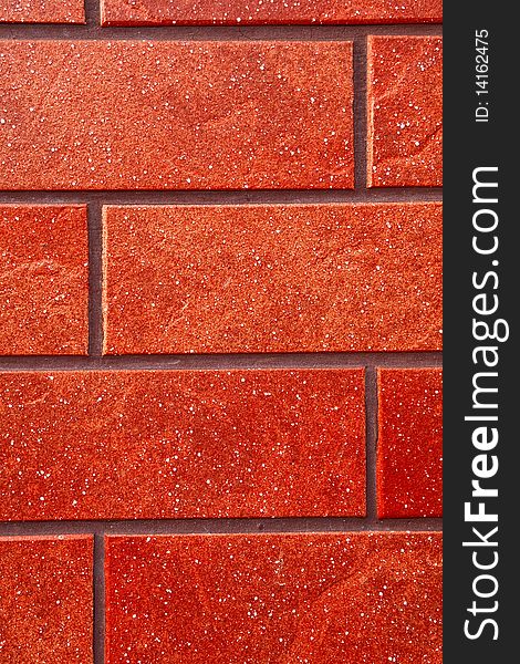 Dark red brick tile wall closeup view. Dark red brick tile wall closeup view.