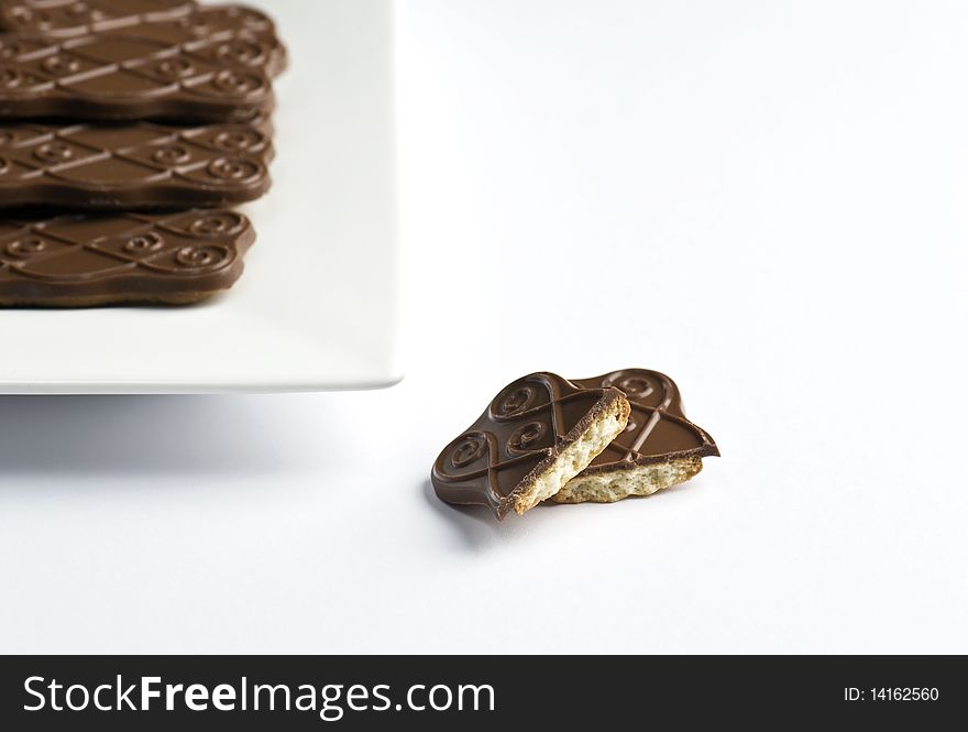 A Plate of Chocolate Biscuits On A White Background