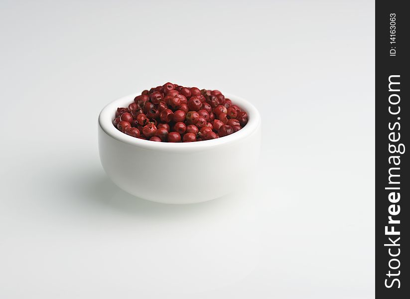 Pink Peppercorns In White Dish On A White Background
