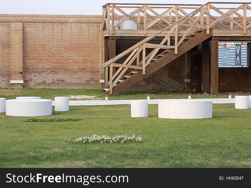 Tables and stools cylinder in a garden. Tables and stools cylinder in a garden