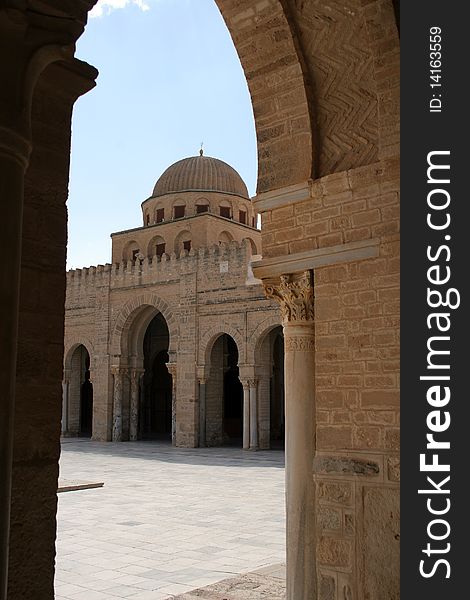 View to the tower of Great mosque from a court yard in Kairuan in Tunisia in Africa