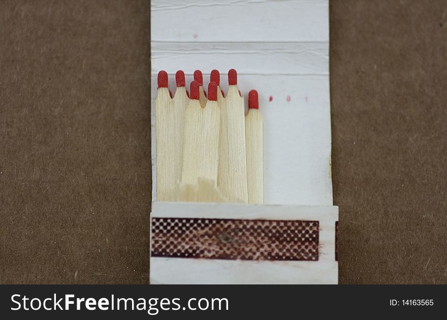 Matchbox on a brown background