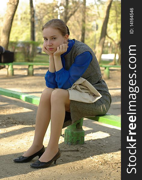Sitting girl on a bench