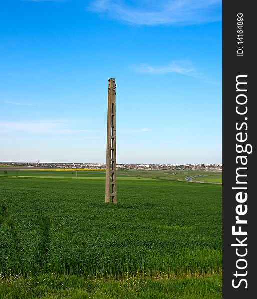 Abandoned light pole in the field