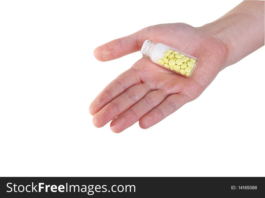 Holding yellow tablets in hand. Holding yellow tablets in hand