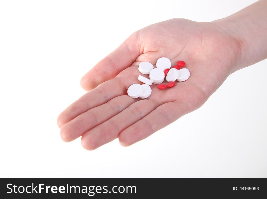 Holding red and white tablets. Holding red and white tablets