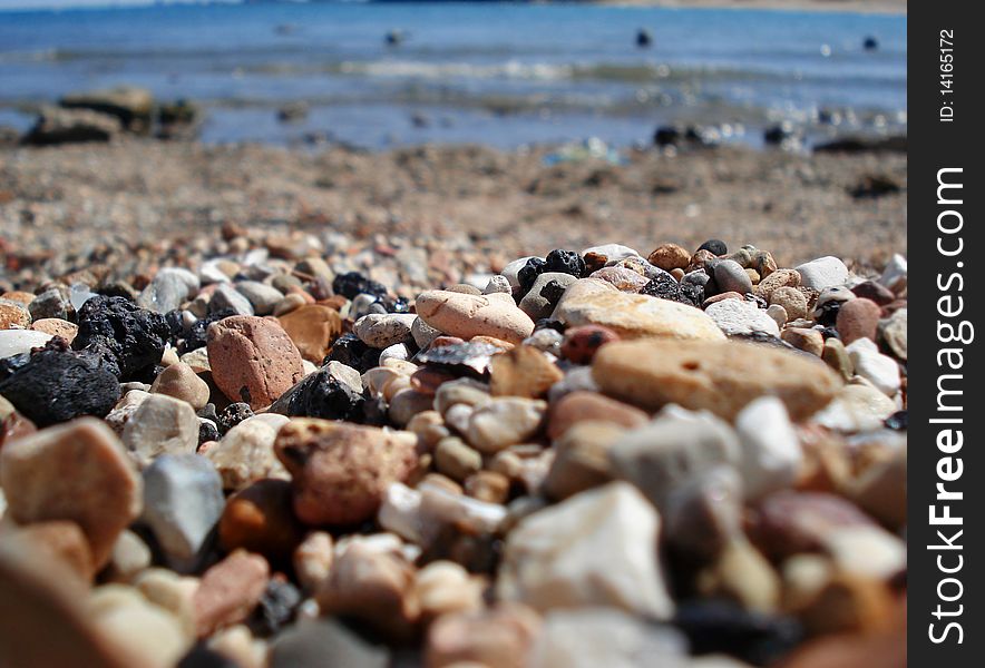 Photo of pebble stones on the lake background