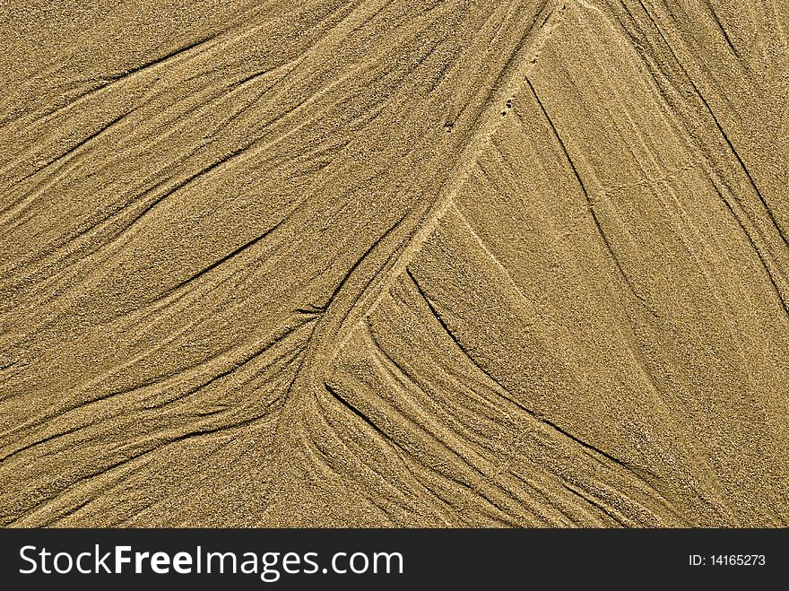 Pattern In The Sand By The Ocean