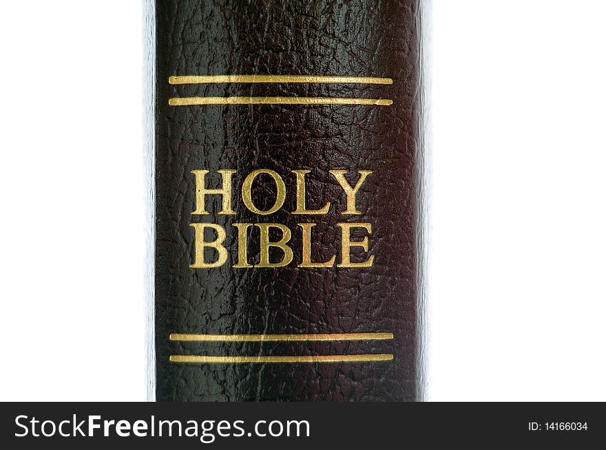 Holy Bible with the spine of the book showing the words Holy Bible isolated on white. Holy Bible with the spine of the book showing the words Holy Bible isolated on white