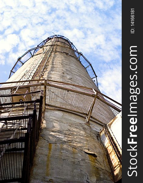 Industry chimney in a blue sky on sunny day