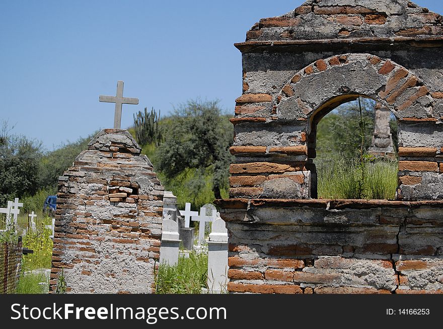 Couple of old brick tombs in a green cementery. Couple of old brick tombs in a green cementery