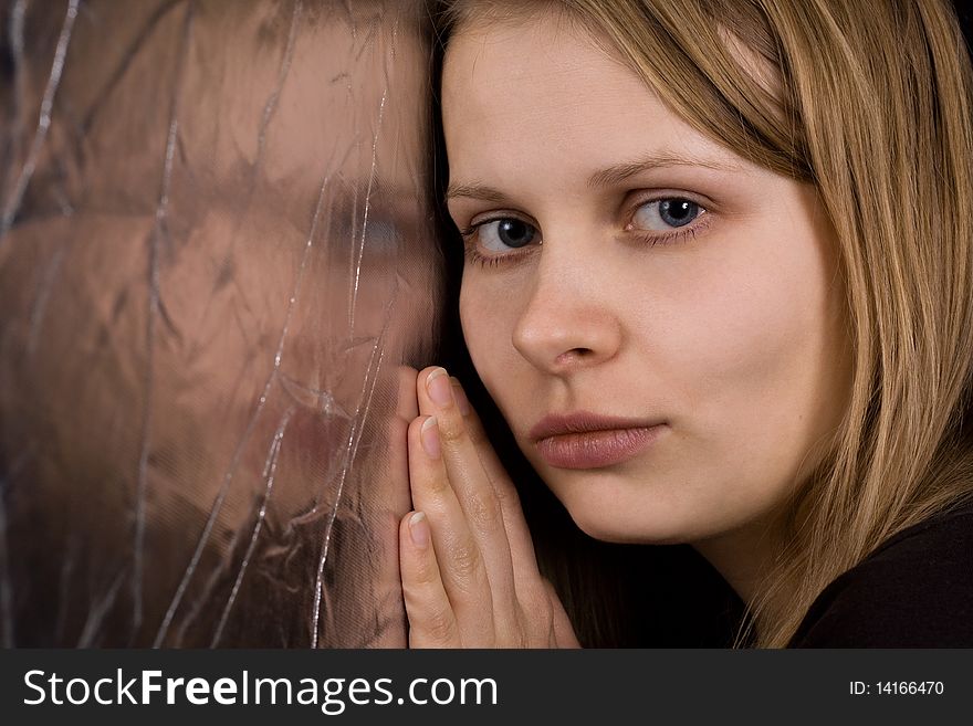 Attractive blonde against reflector. Copy space