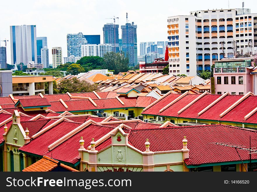 Roof of old houses among modern day architecture at the background. Roof of old houses among modern day architecture at the background.