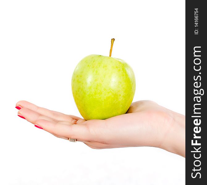 A hand holding a green apple isolated on white background. A hand holding a green apple isolated on white background