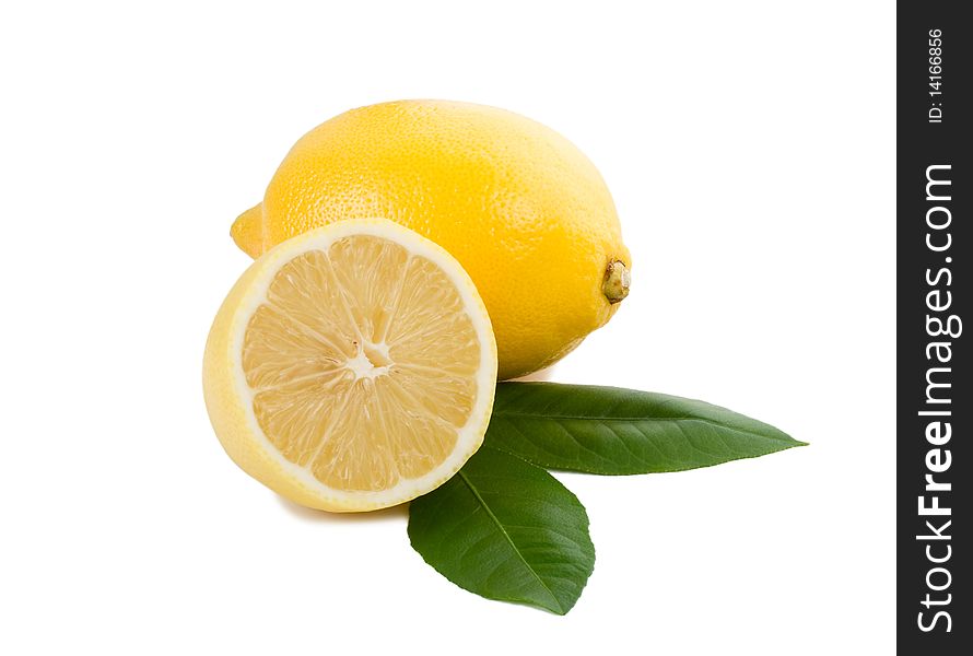 Close-up lemon full and half with leaves, isolated on white