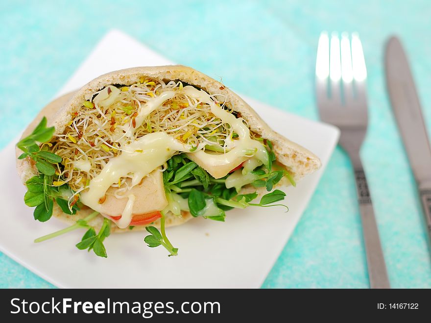 Top view of salad sandwich filled with fresh salad. Healthy eating, diet and nutrition, and lifestyle concepts.