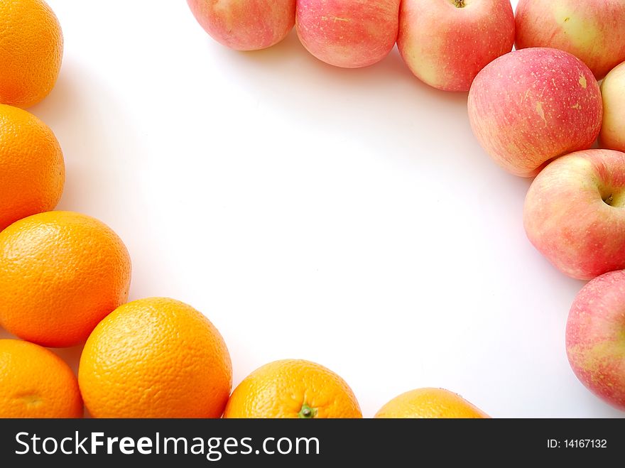 Oranges and apples forming a fruit frame. Also for concepts such as food and beverage, healthy lifestyle, and diet and nutrition.