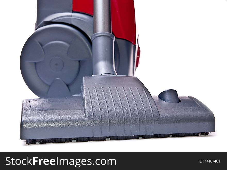 Red vacuum cleaner isolated on white background. Red vacuum cleaner isolated on white background