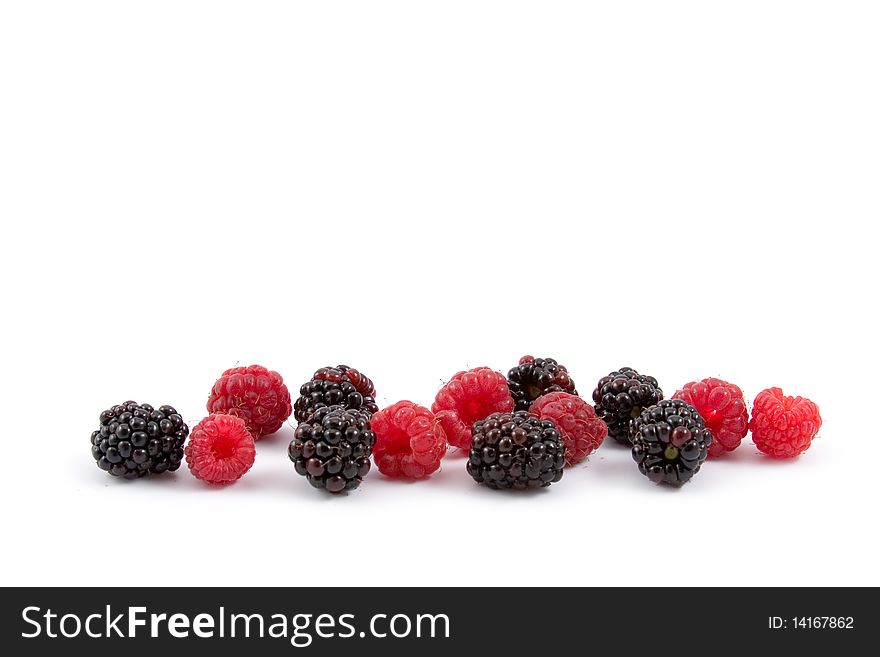 Berries: raspberries and blackberries isolated on a white background