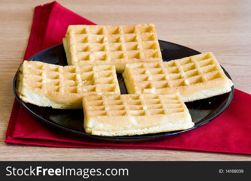 Homemade waffles, on light wood background