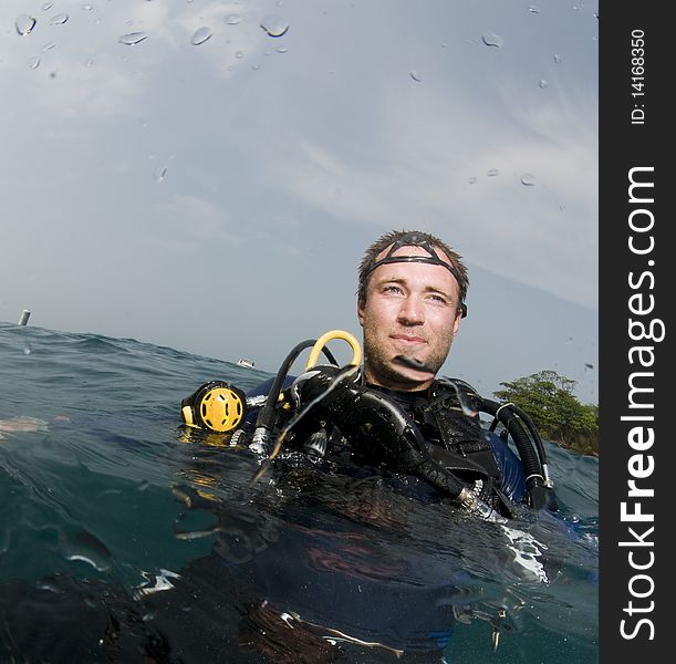 Male scuba diver on the surface