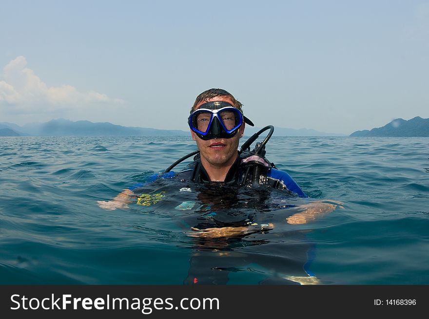 Scuba diver floating on surface. Scuba diver floating on surface