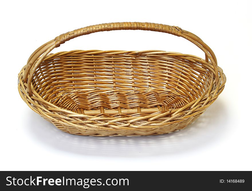 Small wicker basket over the white background