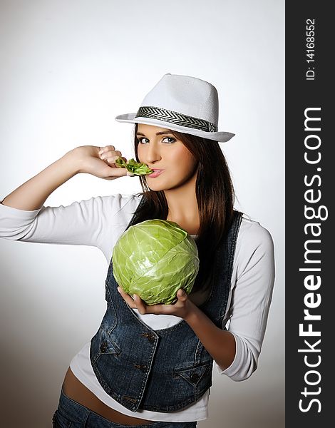 Young Pretty Woman With Green Cabbage