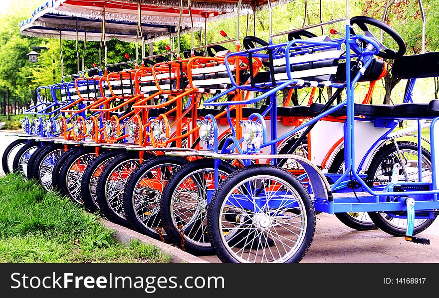 Colorful tricycles in a row