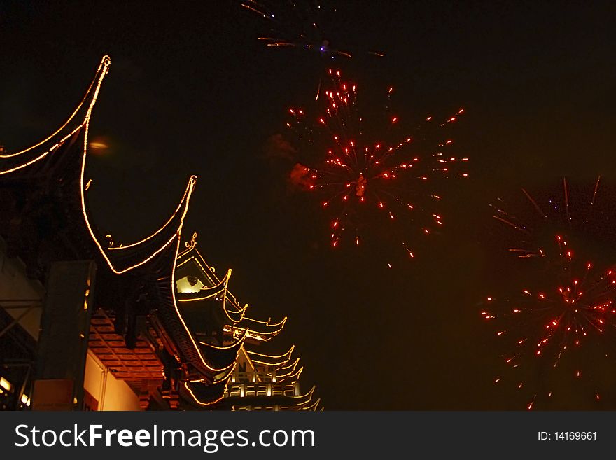 Chinese ancient building decorated in lightingï¼Œwith fireworksï¼Œtook at Shanghai,China. Chinese ancient building decorated in lightingï¼Œwith fireworksï¼Œtook at Shanghai,China.