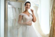 Beautifu Bride Choosing Wedding Dress In A Wedding Salon Stock Photo
