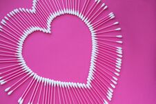 Free Cotton Buds Laid Out In The Shape Of A Heart On A Pink Background Royalty Free Stock Photography - 141698667