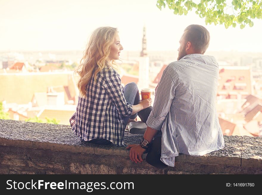 Young loving couple traveling to Tallinn. Love, relations and tourism concept.