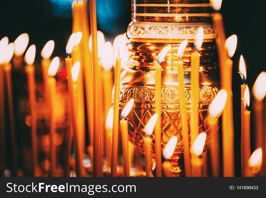 Traditional Burning Candles In Holder In Christian Church.