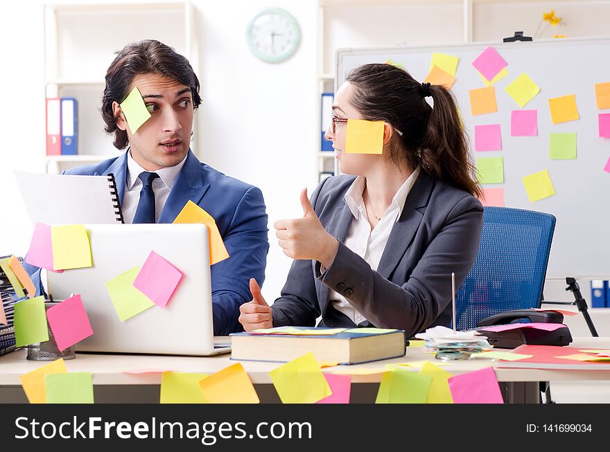 The Two Colleagues Employees Working In The Office