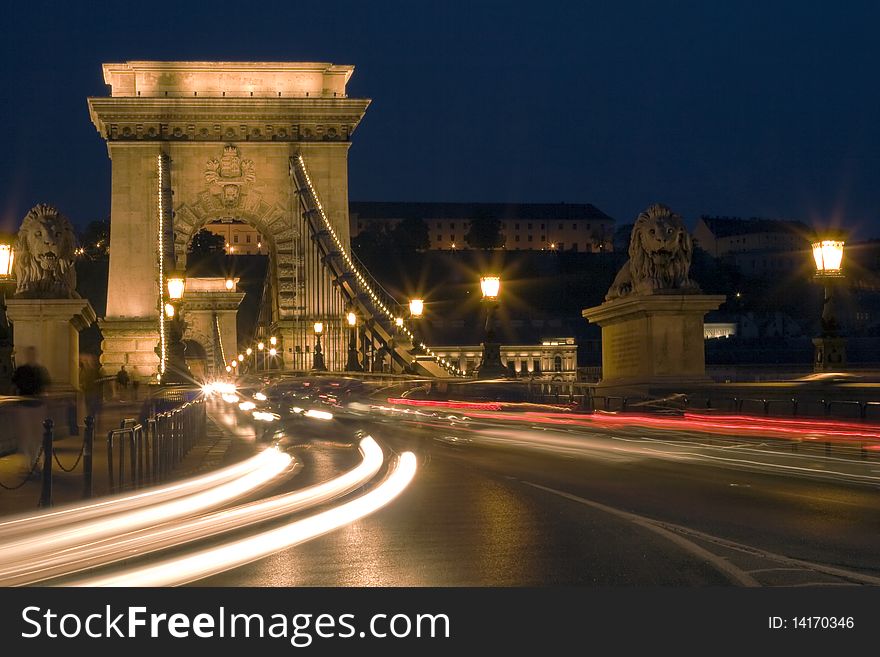 Budapest is a beautiful bridge, the cars are going.